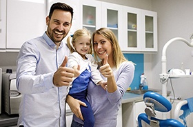 Happy family in dental treatment room