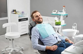Patient smiling during appointment for root canal therapy