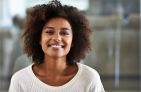 Happy woman smiling after successful root canal therapy