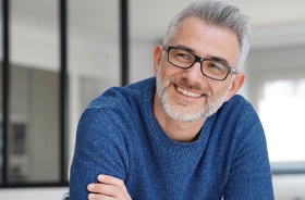 Handsome senior man enjoying benefits of tooth-colored fillings