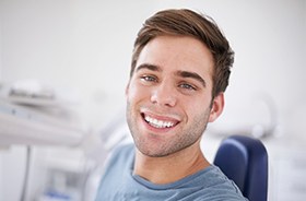 Smiling man in dental chair