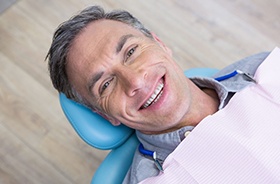 Smiling man in dental chair