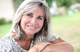 Smiling older woman outdoors