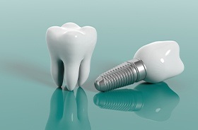 Dental implant in Branford next to a model tooth