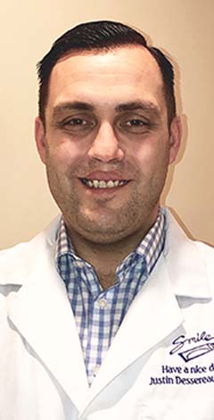 Branford dentist Doctor Justin Dessereaux smiling