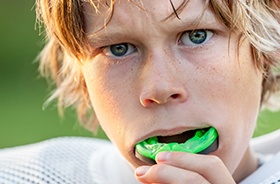 Man placing mouthguard