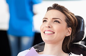 Woman in dental chair smiling