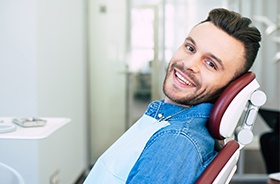 Smiling man in dental chair