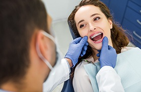 Young woman at orthodontic checkup for professional braces