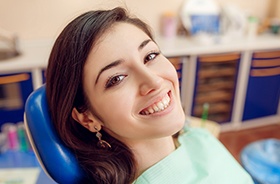 Woman in dental chair smiling