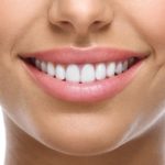 Woman’s beautiful smile after visit to cosmetic dentist in Branford