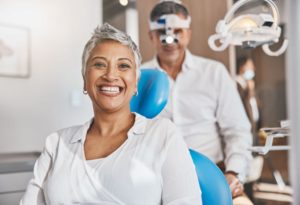 Happy senior woman in dental treatment chair