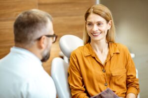 Dentist and patient talking during consultation