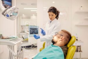 Dentist explaining X-ray to patient