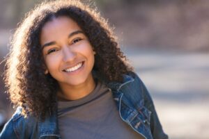 Portrait of smiling young woman with beautiful teeth