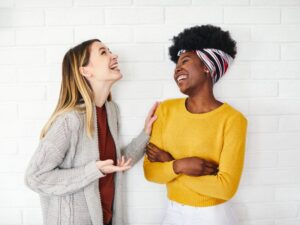 Two female friends having a friendly conversation